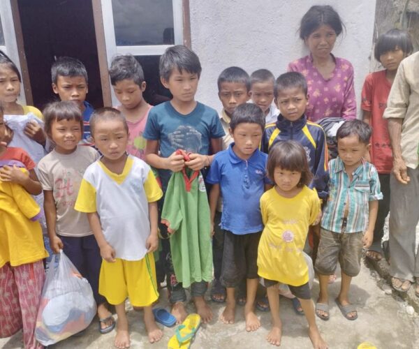 Vital Solutions Work in Nepal, small group of children in Nepal, outdoors.
