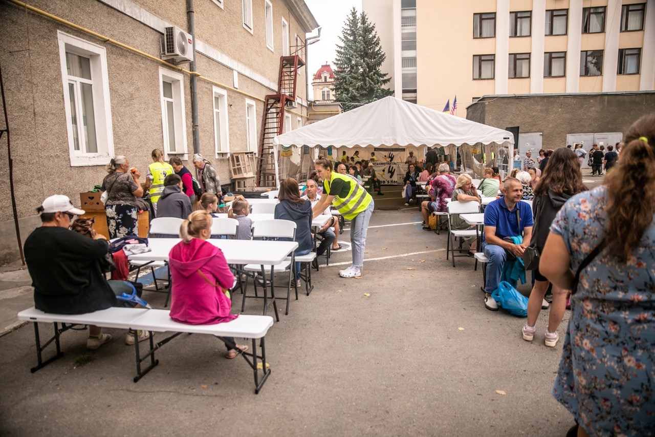 Vital Solutions Ukraine Refugee Relief, feeding groups of people outside.